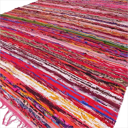 Medium rag rug in red with multicolored recycled fabric strips showing textured woven rag rugs surface