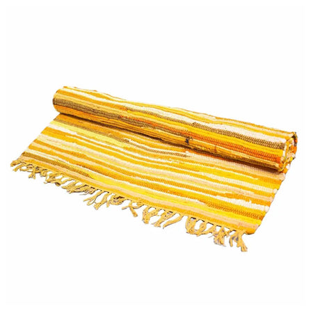 A rolled-up medium rag rug in sunrise oranges with yellow and white stripes and fringed edges made from cotton fibers