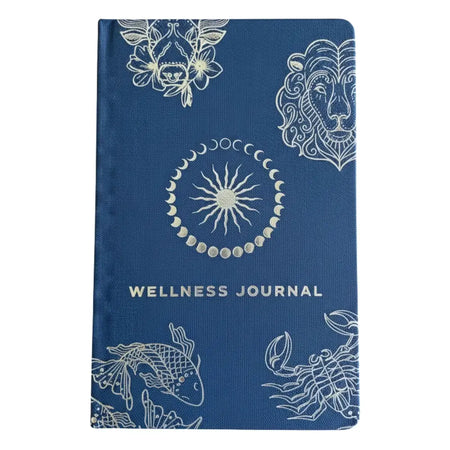 Deep blue wellness journal with white zodiac and celestial designs and wellness journal title in simple font