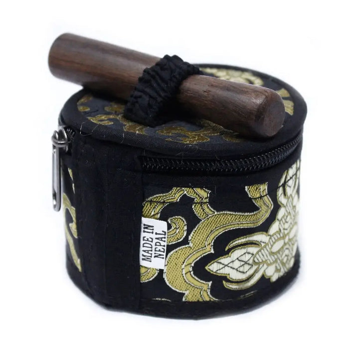 Black and gold patterned fabric case holding a dark wood mallet for a mini singing bowl gift set black