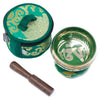 Green and gold mini singing bowl with ornate patterns and wooden mallet in a matching green embroidered carrying case