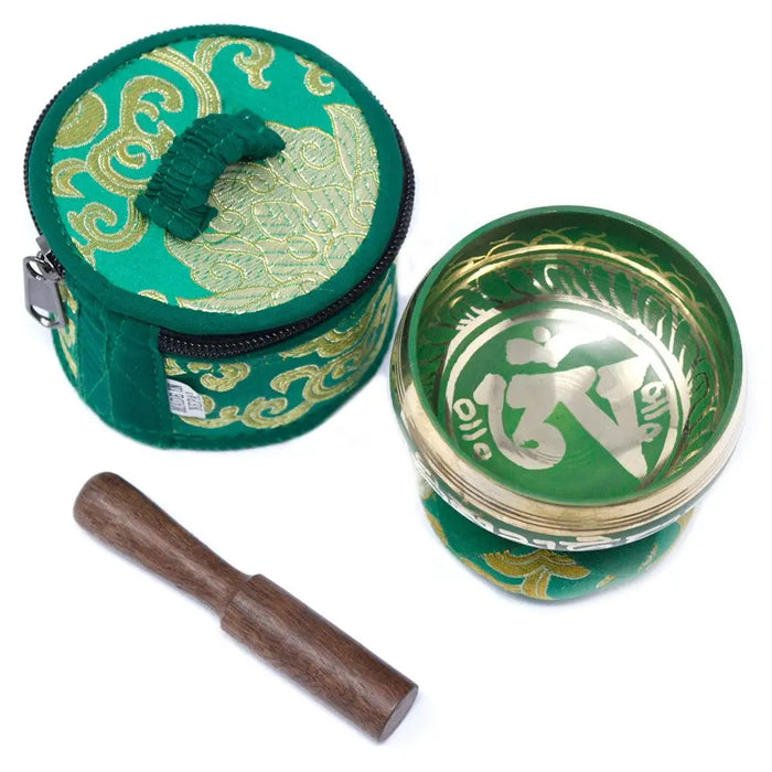 Green and gold mini singing bowl with ornate patterns and wooden mallet in a matching green embroidered carrying case