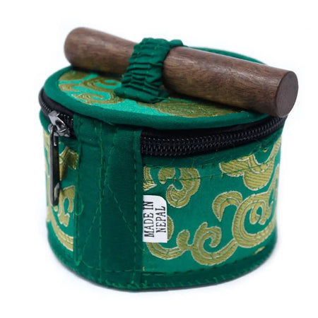 Green velvet-covered mini singing bowl with gold embroidery and wooden mallet in a mini singing bowl gift set