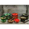 Mini singing bowl gift set with three singing bowls and wooden mallets in green red and black embroidered cases