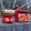 Mini singing bowl in red and gold embroidery with wooden mallet in a red velvet carrying case gift set