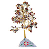 A mixed stone gemstone tree with gold wire frame and multicolored gemstone chips on a painted stone base
