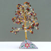 A mixed stone gemstone tree with 320 colorful gemstone chips on a golden wire frame and painted stone base