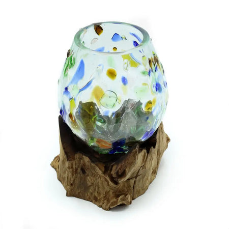 A colorful hand-blown recycled glass candle holder with blue yellow and green swirls on a gamal wood base