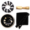 Black singing bowl set with gold moon phase design inside used to release negative emotions and for meditation
