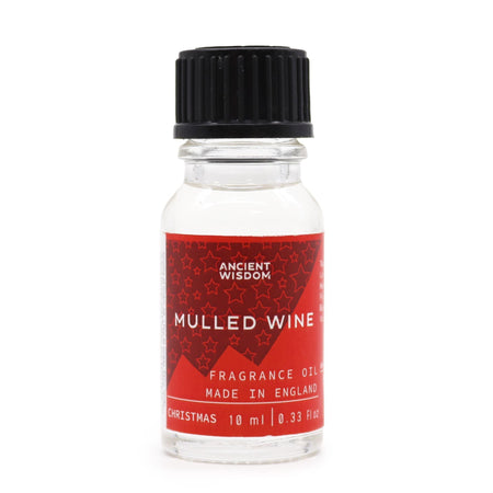 A clear glass bottle with black ribbed cap and red label of ancient wisdom mulled wine fragrance oil for diffusers and candles