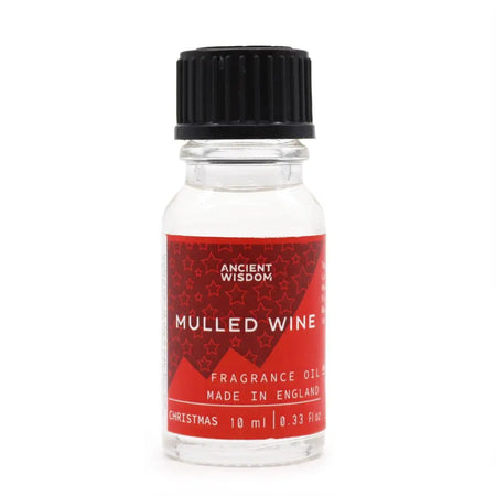 A clear glass bottle with black ribbed cap and red label of ancient wisdom mulled wine fragrance oil for diffusers and candles