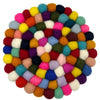 A round multi-colour felt ball placemat made of dense wool balls with a vibrant textured pattern
