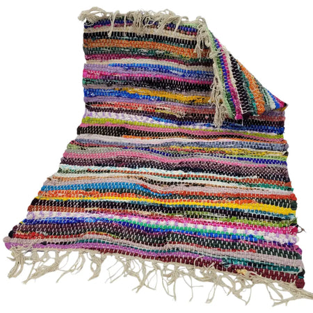 A vibrant multi-coloured dari rug with striped recycled fabric and fringed edges in assorted sizes