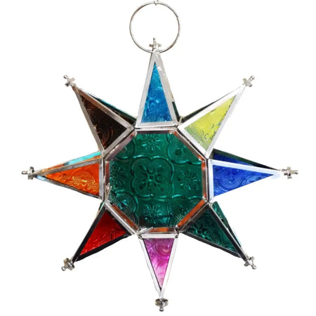A multi-coloured star tealight lantern with an eight-pointed stained glass design, embossed patterns, and a metal frame