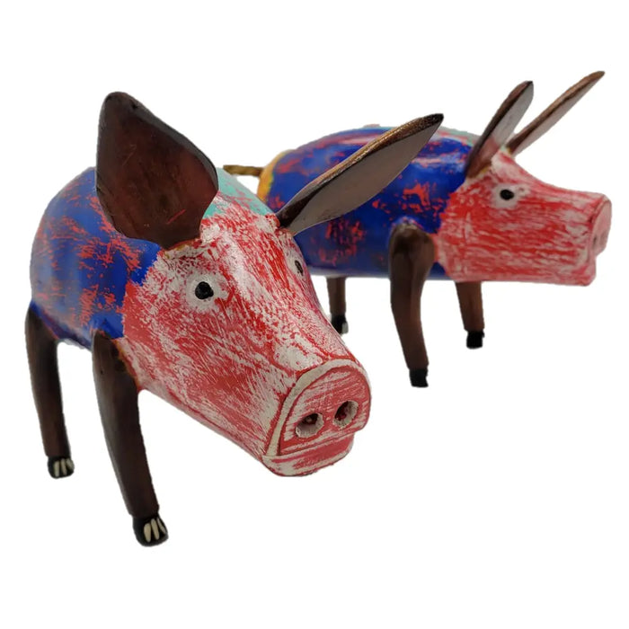 Multi-coloured wooden pig ornament with hand-painted distressed red and blue paint and brown ears and legs