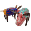 Hand-painted multi-coloured wooden pig ornament with distressed red blue and teal paintwork on rustic figurines