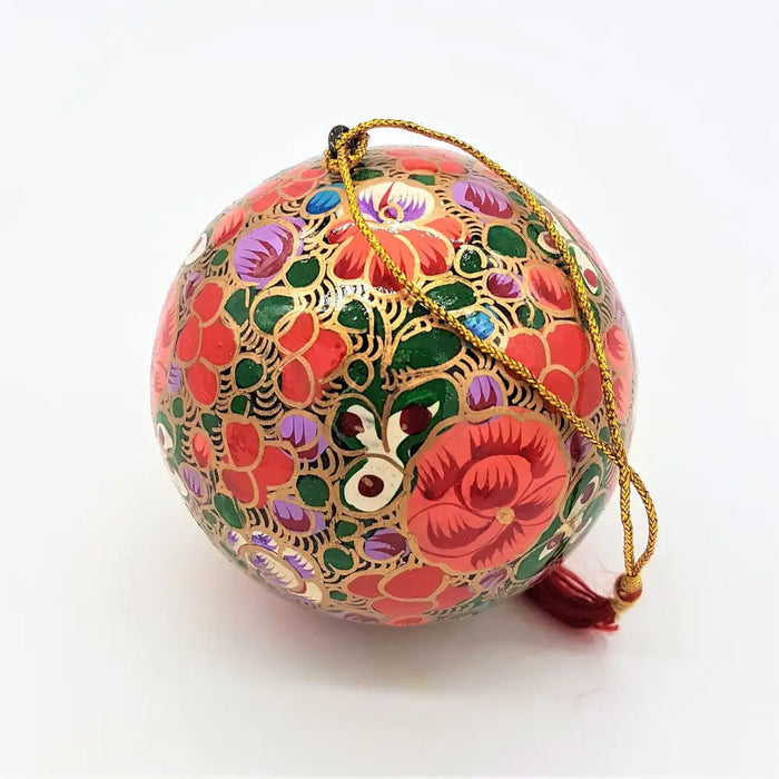 Multi floral hand-painted papier maché bauble with red green and purple floral patterns outlined in gold