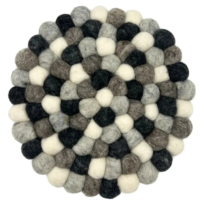 Round multi-grey felt ball placemat made of interlocking black white and gray wool balls