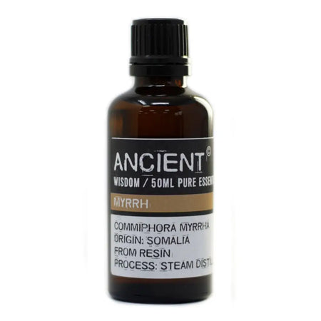 A dark amber glass bottle of myrrh essential oil 50ml with a black cap and label showing its resin origin from somalia