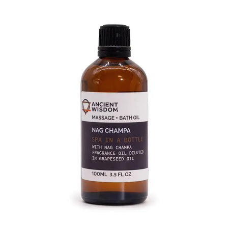 An amber glass bottle of ancient wisdom nag champa champa massage oil with black ribbed cap and essential oils label