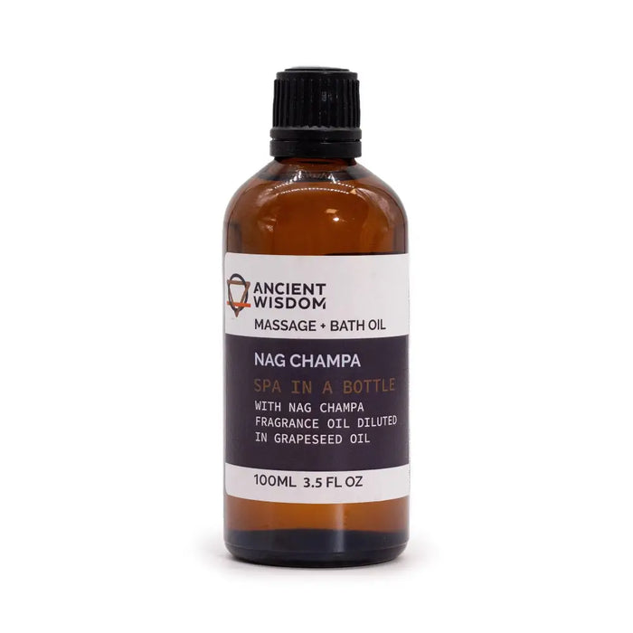 An amber glass bottle of ancient wisdom nag champa champa massage oil with black ribbed cap and essential oils label
