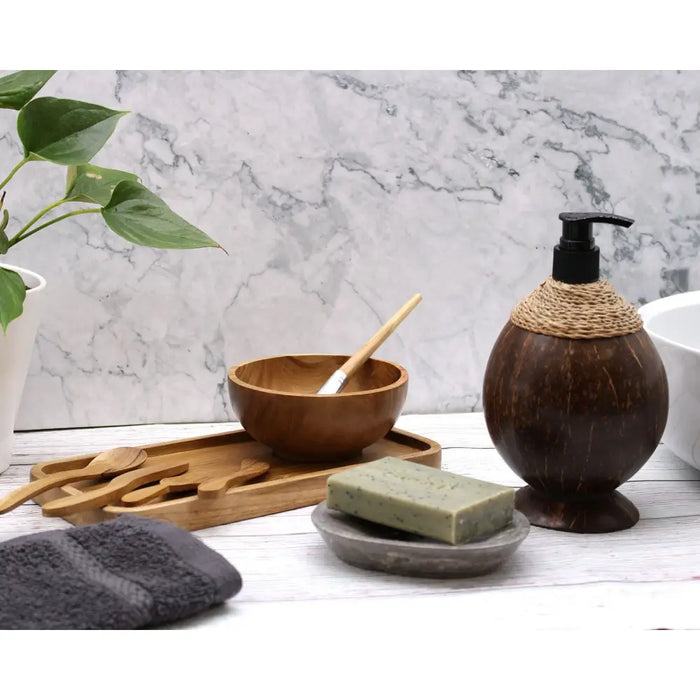 Dark brown coconut soap dispenser with black pump and woven rope accent made from coconut shell 150ml capacity