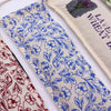 Beige cotton eye pillow with blue floral pattern filled with wheat, part of natural heating bags collection