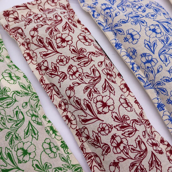 Beige cotton and wheat heating bags with red blue and green floral embroidery in a natural cotton and wheat purple set