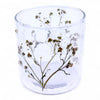 Clear glass candle holder with dried baby’s breath flowers embedded in recycled glass textured surface
