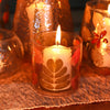 Natural floral glass straight candle holder with white candle golden leaf design in recycled glass and autumn leaves