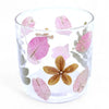 Clear glass candle holder with pressed pink and brown flowers made from recycled glass for natural decor