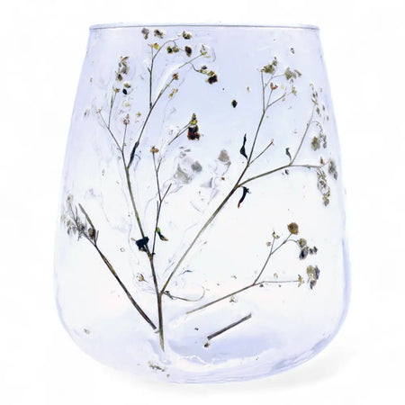Clear glass recycled glass candle holder vase with preserved baby’s breath and dried botanicals natural floral style