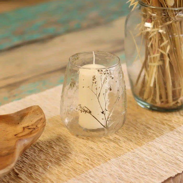 Natural floral glass vase candle holder with white pillar candle in clear recycled glass and dried flower design