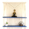 Cream-colored macrame hanging shelves with two blue wooden shelves in natural macrame hanging design