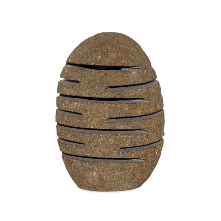 Brown stone standing candle holder shaped like an egg with horizontal slotted bands made from natural riverstone