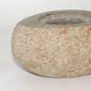 Rounded natural riverstone trinket pot in gray and beige granite with a speckled textured surface