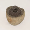 Natural riverstone trinket pot medium with rough textured weathered stone mortar and dark gray pestle inside