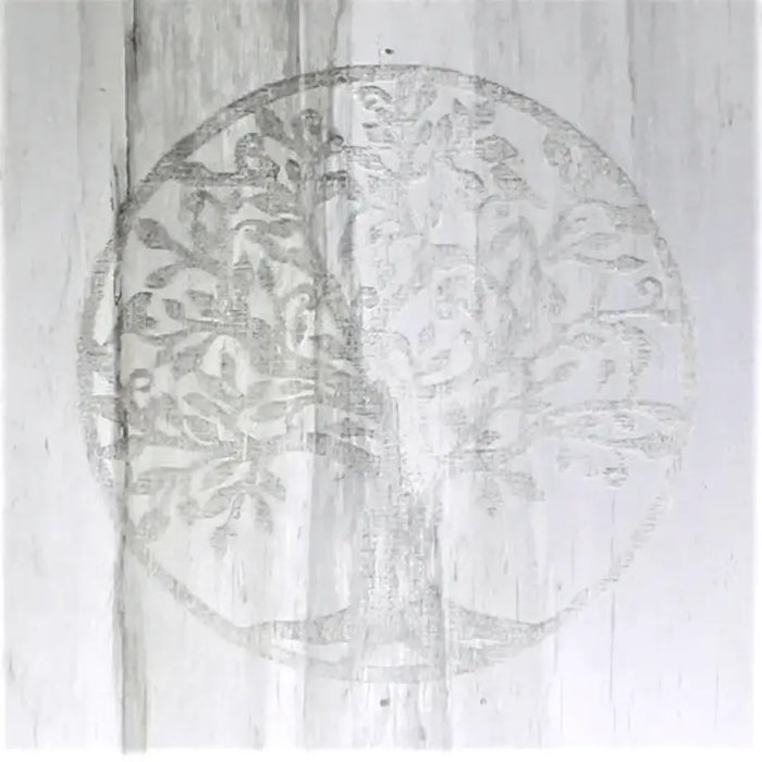 Natural selenite block lamp with a silver-toned circular tree of life design engraved on its surface