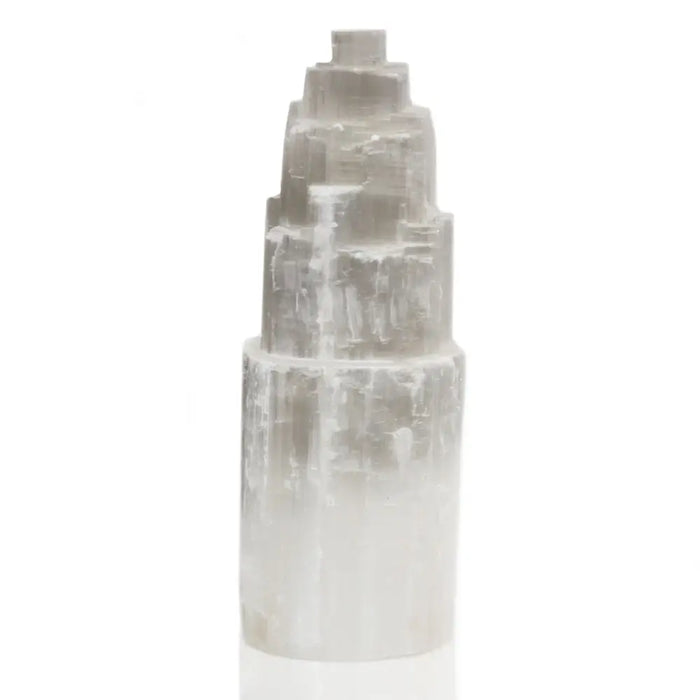 Natural selenite tower lamp with a pale gray translucent stepped pyramid top and smooth cylindrical base in selenite tower design