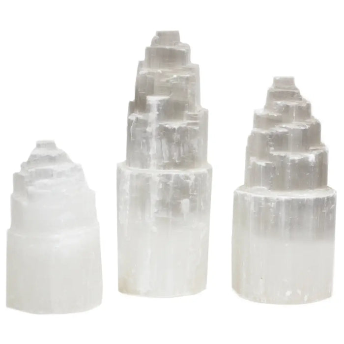 Natural selenite tower lamps in three sizes with translucent white stepped pyramid-like crystal formations