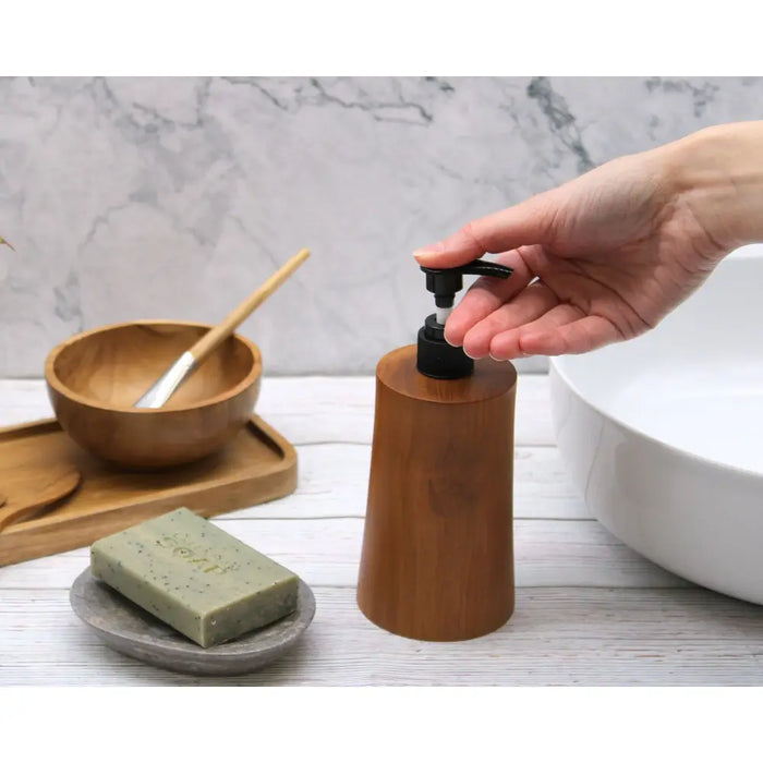 A sleek natural teakwood soap dispenser with a matte black pump made from java teak, tapered 200ml design