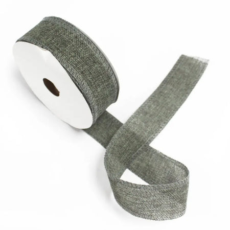 A roll of charcoal natural texture ribbon made of gray burlap with a subtle woven pattern