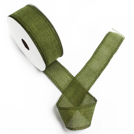 A natural texture ribbon in christmas green made of olive green mesh fabric wound on a white paper core