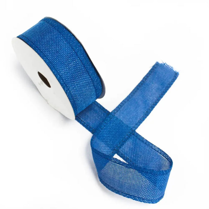 Natural texture ribbon in navy blue mesh wound on a white spool for crafts and decor projects