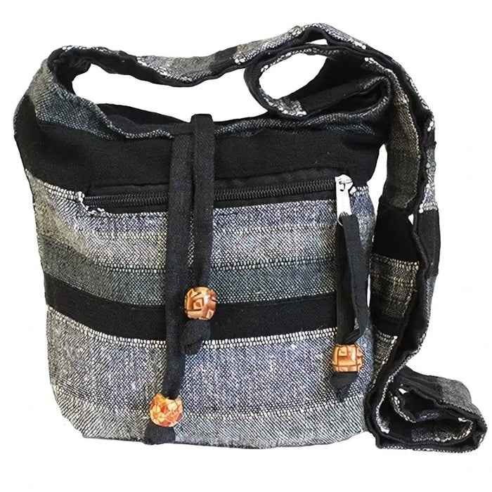Black and gray striped denim nepal sling bag with wooden toggle closures called mountain granite sling bag