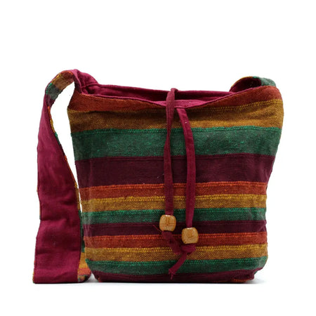 Nepal sling bag with handwoven maroon green and orange yellow stripes and wooden bead drawstring closure