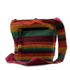 Nepal sling bag with earthy red orange green stripes handwoven fabric and wooden toggle zipper pull for mountain trek