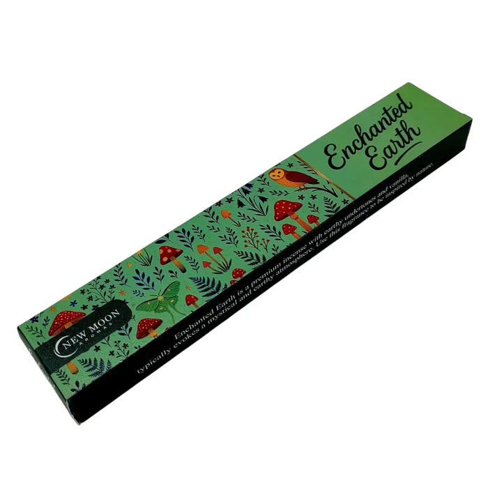 Green and black rectangular box of new moon aromas enchanted earth incense sticks with forest design and mushrooms
