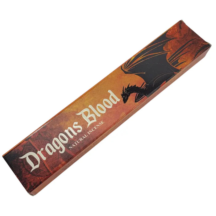 A rectangular box of new moon aromas natural incense sticks with black dragon art on orange textured background