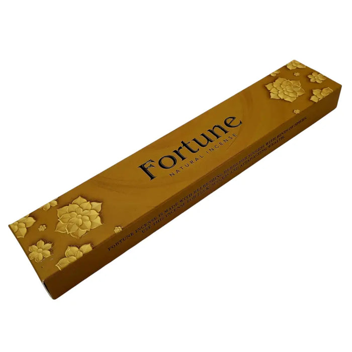 Gold rectangular box of fortune natural incense with embossed flowers and black text from new moon Aromas moon aromas collection